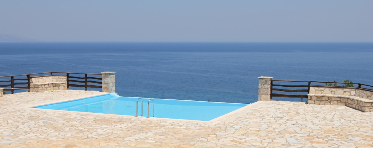 swimming pool near the ocean landdscape